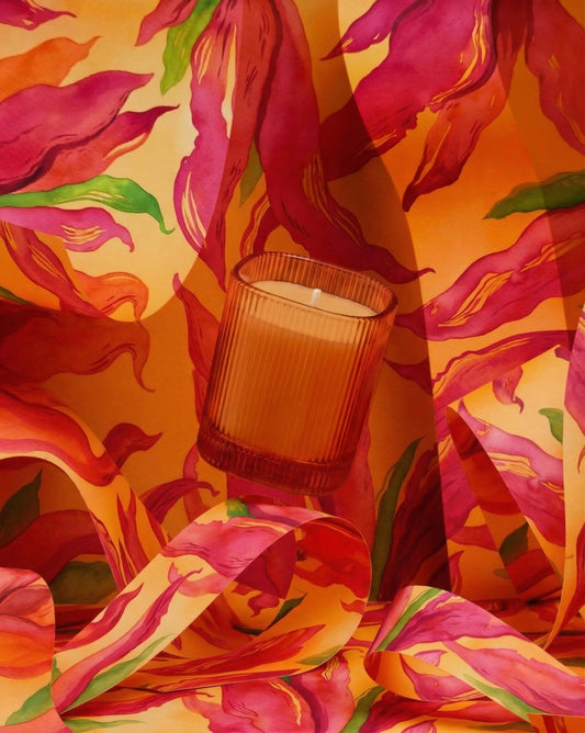 Vela perfumada Oriental Oud en vaso rayado naranja 9x8 cm Roura